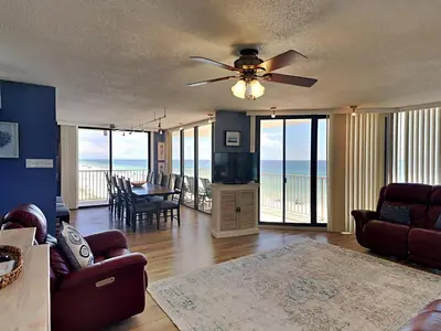 a living room with a couch and a ceiling fan at Edgewater Leeward #500 in Panama City Beach
