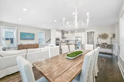 a dining room and living room with a table and chairs at Beach Bliss 30A in Destin