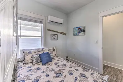 a bedroom with a bed and a window at Inlet Beach Escape about half Mi to Beach Access! in Inlet Beach