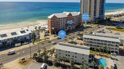an aerial view of a city with the beach and buildings at Sand Castles West T8 in Panama City Beach
