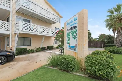 a building with a sign on the side of it at Sand Castles West T8 in Panama City Beach