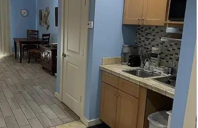 a kitchen with a sink and a counter top at Origin at Seahaven in Panama City Beach
