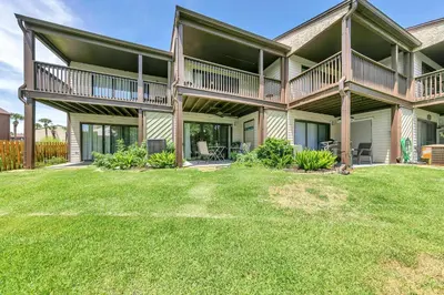 a large house with a yard in front of it at Portside K5 in Panama City Beach