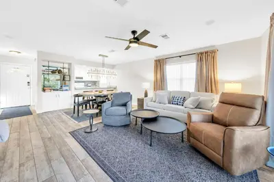 a living room with a couch and chairs and a table at Cassine Gardens 273- Kwitcherbeachin' in Santa Rosa Beach
