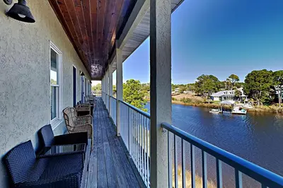 a balcony of a house with a view of a river at Bonita Point Condo II #214E in Panama City Beach