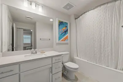 a bathroom with a sink and a toilet and a shower at New Calypso Beach Resort Corner Unit Sleeps 8! by Dolce Vita Getaways PCB in Panama City Beach