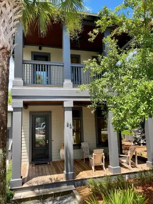 a house with a front porch with a deck at The Summer Palace in Inlet Beach