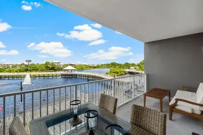 a balcony with a view of a body of water at Stunning Views! located Steps 2 Beach, Restaurants & Shops! by Dolce Vita Getaways PCB in Panama City Beach