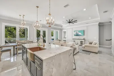 a kitchen and living room with a large island at 30A Pet Friendly Beach House - Seacrest Serenity by Panhandle Getaways in Inlet Beach