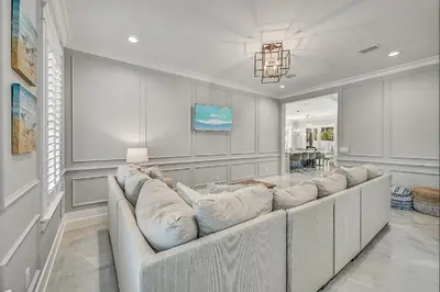 a living room with a large couch in a room at 30A Pet Friendly Beach House - Seacrest Serenity by Panhandle Getaways in Inlet Beach
