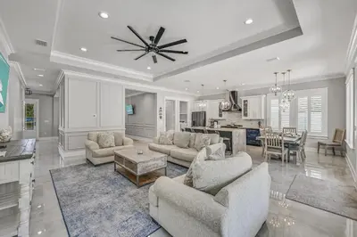 a living room with two couches and a dining room at 30A Pet Friendly Beach House - Seacrest Serenity by Panhandle Getaways in Inlet Beach