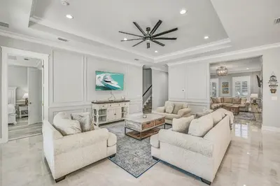 a living room with two couches and a table at 30A Pet Friendly Beach House - Seacrest Serenity by Panhandle Getaways in Inlet Beach