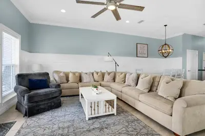 a living room with a couch and a chair at Vista del Mar I BEST Day 202 in Panama City Beach