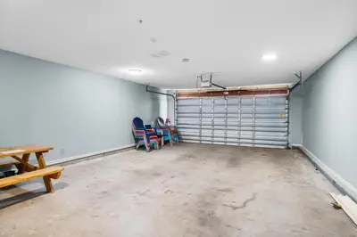 an empty garage with a table and chairs in it at Vista del Mar I BEST Day 202 in Panama City Beach