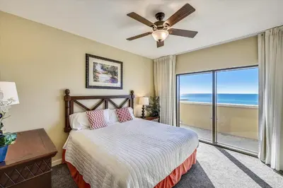a bedroom with a bed and a ceiling fan at Origin at Seahaven 403 - Spacious 3 Bedroom withSunset View! Free Fun! condo in Panama City Beach