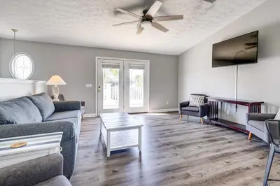 a living room with a couch and a ceiling fan at Private Pool and Hot Tub at Panama City Home! in Panama City Beach