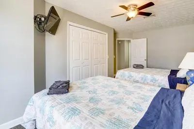 a bedroom with two beds and a ceiling fan at Private Pool and Hot Tub at Panama City Home! in Panama City Beach