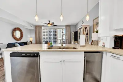 a kitchen with a sink and a dishwasher at Spring Break Friendly Ages 21–25+ OK in Panama City Beach
