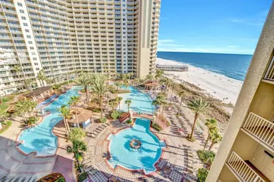 an aerial view of a resort with a pool and the beach at Spring Break Friendly Ages 21–25+ OK in Panama City Beach