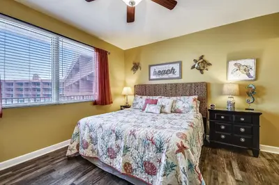 a bedroom with a bed and a window at Shores of Panama 2217- Elegantly Decorated, Sleeps 6, Free Fun! condo in Panama City Beach
