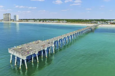 an aerial view of a pier in the water with a beach at Shores of Panama 1206 - Amazing Studio, Free Fun! Sleeps 3, Romantic condo in Panama City Beach
