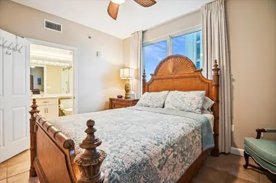 a bedroom with a large bed and a window at Shores of Panama 401 - 4th Floor 3 Bedroom 3 Bath Sleeps 8, Same Floor Resv, Parking! Updated! condo in Panama City Beach