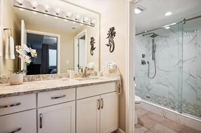a bathroom with a shower and a sink and a toilet at Shores of Panama 401 - 4th Floor 3 Bedroom 3 Bath Sleeps 8, Same Floor Resv, Parking! Updated! condo in Panama City Beach