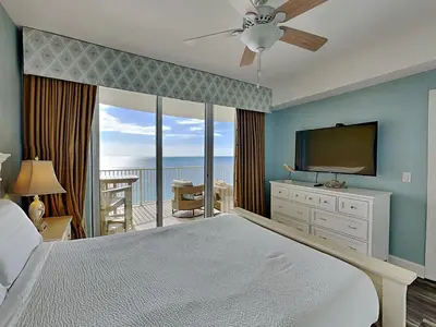 a bedroom with a bed and a flat screen tv at Emerald Isle Panama City Beach #2208 in Panama City Beach