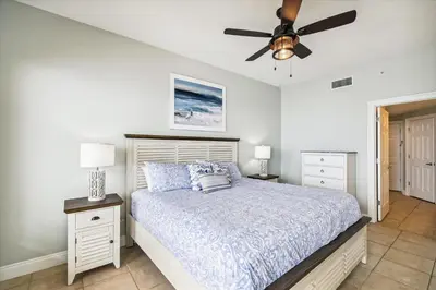 a bedroom with a bed and a ceiling fan at Gulf Crest 2005 - 2 Bedroom 2Bathroom withFantastic View! Family Friendly! Sleeps 8 condo in Panama City Beach