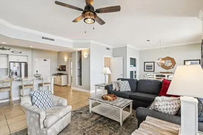 a living room with a couch and a table at Gulf Crest 2005 - 2 Bedroom 2Bathroom withFantastic View! Family Friendly! Sleeps 8 condo in Panama City Beach