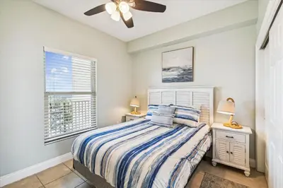 a bedroom with a bed and a ceiling fan at Gulf Crest 2005 - 2 Bedroom 2Bathroom withFantastic View! Family Friendly! Sleeps 8 condo in Panama City Beach