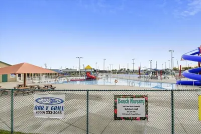 a water park with a water slide and slides at Cozy Holiday Hideaway, Sleeps 4! Steps to the Beach! Renovated 2021 condo in Panama City Beach