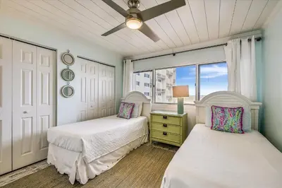 a bedroom with two beds and a window at Pinnacle Port A502 - Updated 3 Bedroom 3 Bathroom Sleeps 8, Free Fun! Boat Ramp Access! condo in Panama City Beach