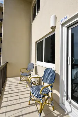 a couple of chairs sitting on a balcony at Pinnacle Port A502 - Updated 3 Bedroom 3 Bathroom Sleeps 8, Free Fun! Boat Ramp Access! condo in Panama City Beach