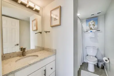 a bathroom with a sink and a toilet at Pinnacle Port A502 - Updated 3 Bedroom 3 Bathroom Sleeps 8, Free Fun! Boat Ramp Access! condo in Panama City Beach