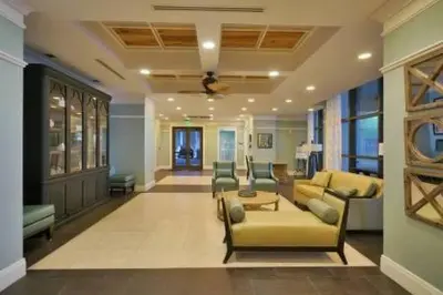 a living room with a yellow couch and chairs at Origin 1036, Perfect for 4! Beautiful sunset and Gulf of Mexico view! Free Activities! condo in Panama City Beach