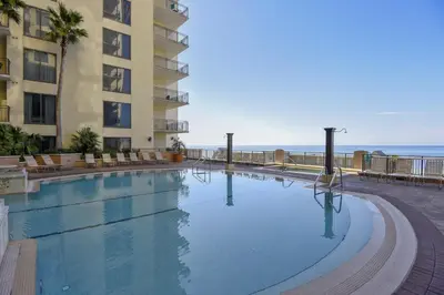 a large swimming pool in front of a building at Origin 1036, Perfect for 4! Beautiful sunset and Gulf of Mexico view! Free Activities! condo in Panama City Beach