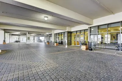 an empty lobby of a building with a brick floor at Origin 1036, Perfect for 4! Beautiful sunset and Gulf of Mexico view! Free Activities! condo in Panama City Beach