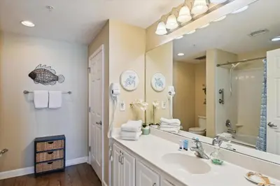 a bathroom with a sink and a mirror at Sterling Reef 202 - 2nd Floor withUninterrupted Gulf View! Free Fun! Free Gas Card! condo in Panama City Beach