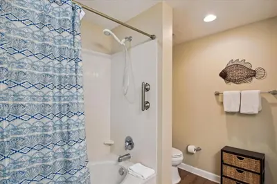 a bathroom with a shower and a toilet at Sterling Reef 202 - 2nd Floor withUninterrupted Gulf View! Free Fun! Free Gas Card! condo in Panama City Beach