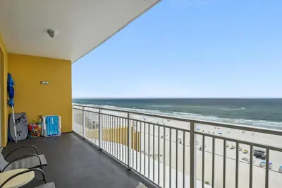 a balcony with a view of the beach at Sterling Reef 202 - 2nd Floor withUninterrupted Gulf View! Free Fun! Free Gas Card! condo in Panama City Beach