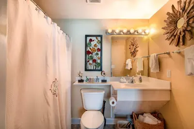 a bathroom with a toilet and a sink at Shores of Panama 621-Sleeps 8, Free Beach Fun! Reserved Parking Space! condo in Panama City Beach