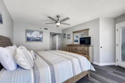 a bedroom with a bed and a ceiling fan at Long Beach Tower 3, #1303 - Completely Renovated 2 Bedroom Sleeps 8, condo in Panama City Beach