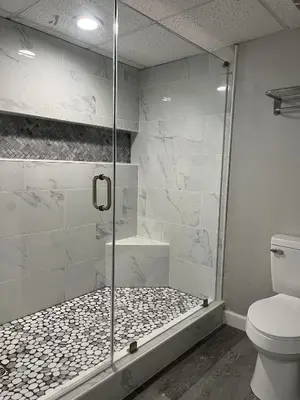 a bathroom with a glass shower with a toilet at Long Beach Tower 3, #1303 - Completely Renovated 2 Bedroom Sleeps 8, condo in Panama City Beach