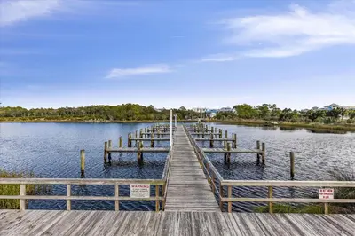 a dock on a body of water at Recently renovated 2Bd, Sleeps 6 Pinnacle Port, with Boat Ramp condo in Panama City Beach