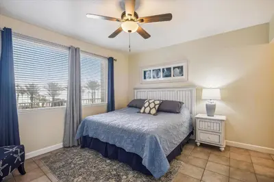 a bedroom with a bed and a ceiling fan at Shores of Panama 316 - 3rd Floor 1 Bedroom, Sleeps 6, Reserved Parking Space, Free Daily Fun! condo in Panama City Beach