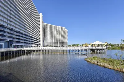 a bridge over a river in front of a building at Laketown Wharf 1003, Gulf View, Sleeps 6, Free Fun! Updated! condo in Panama City Beach