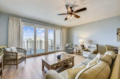 a living room with a couch and a ceiling fan at Laketown Wharf 1003, Gulf View, Sleeps 6, Free Fun! Updated! condo in Panama City Beach