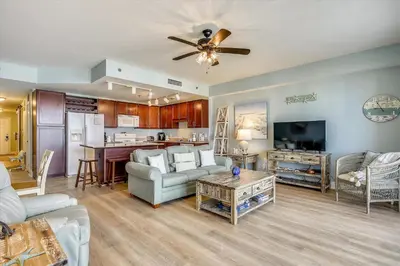 a living room with a couch and a table at Laketown Wharf 1003, Gulf View, Sleeps 6, Free Fun! Updated! condo in Panama City Beach