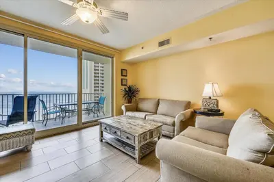 a living room with two couches and a balcony at Shores of Panama 821-2 Bd 3Ba, Sleeps 8! Updated, No Carpet! Free Fun! condo in Panama City Beach